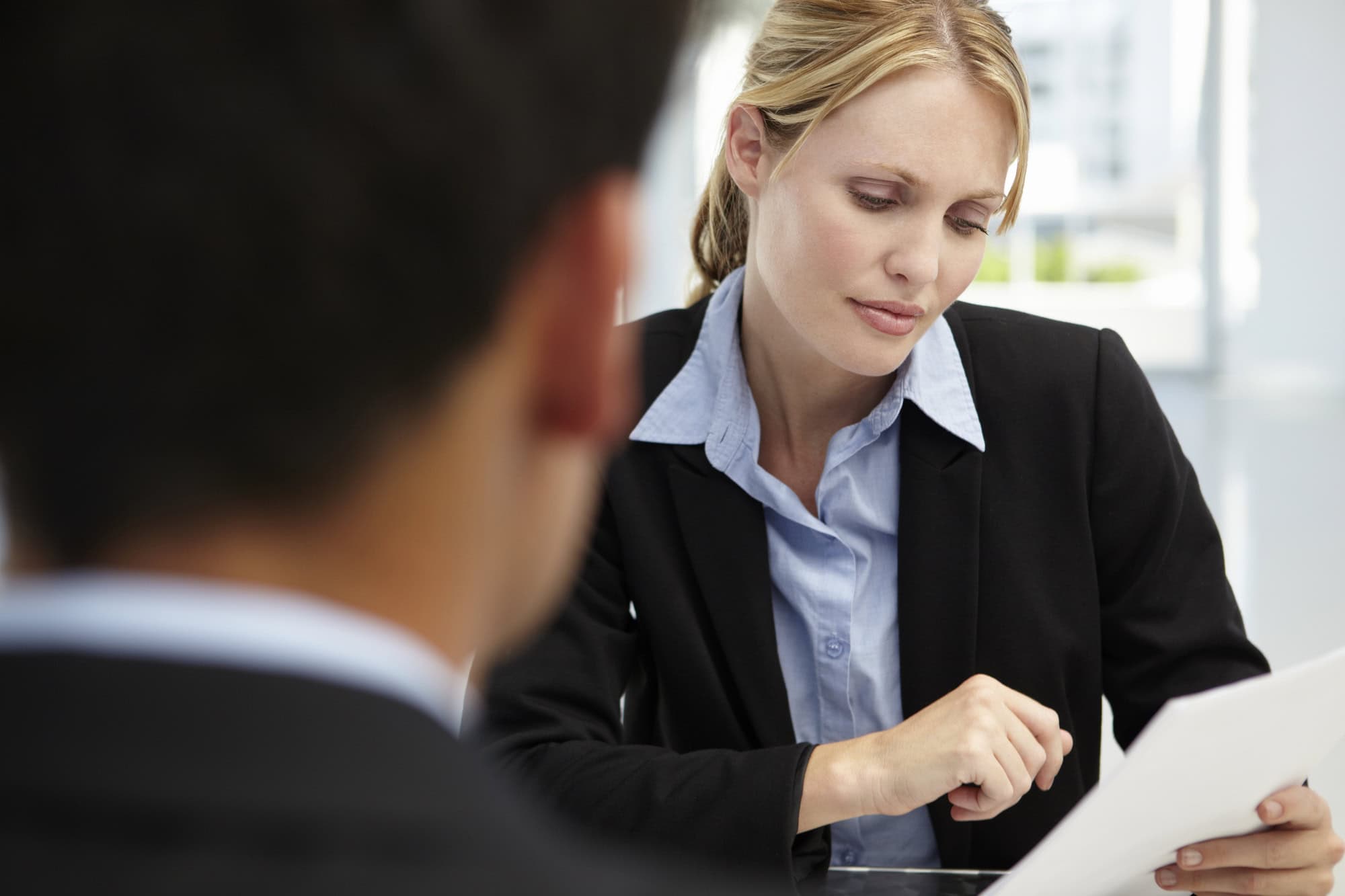 A human resources professional reviewing LTD benefit transferability rules with an employee leaving the company.