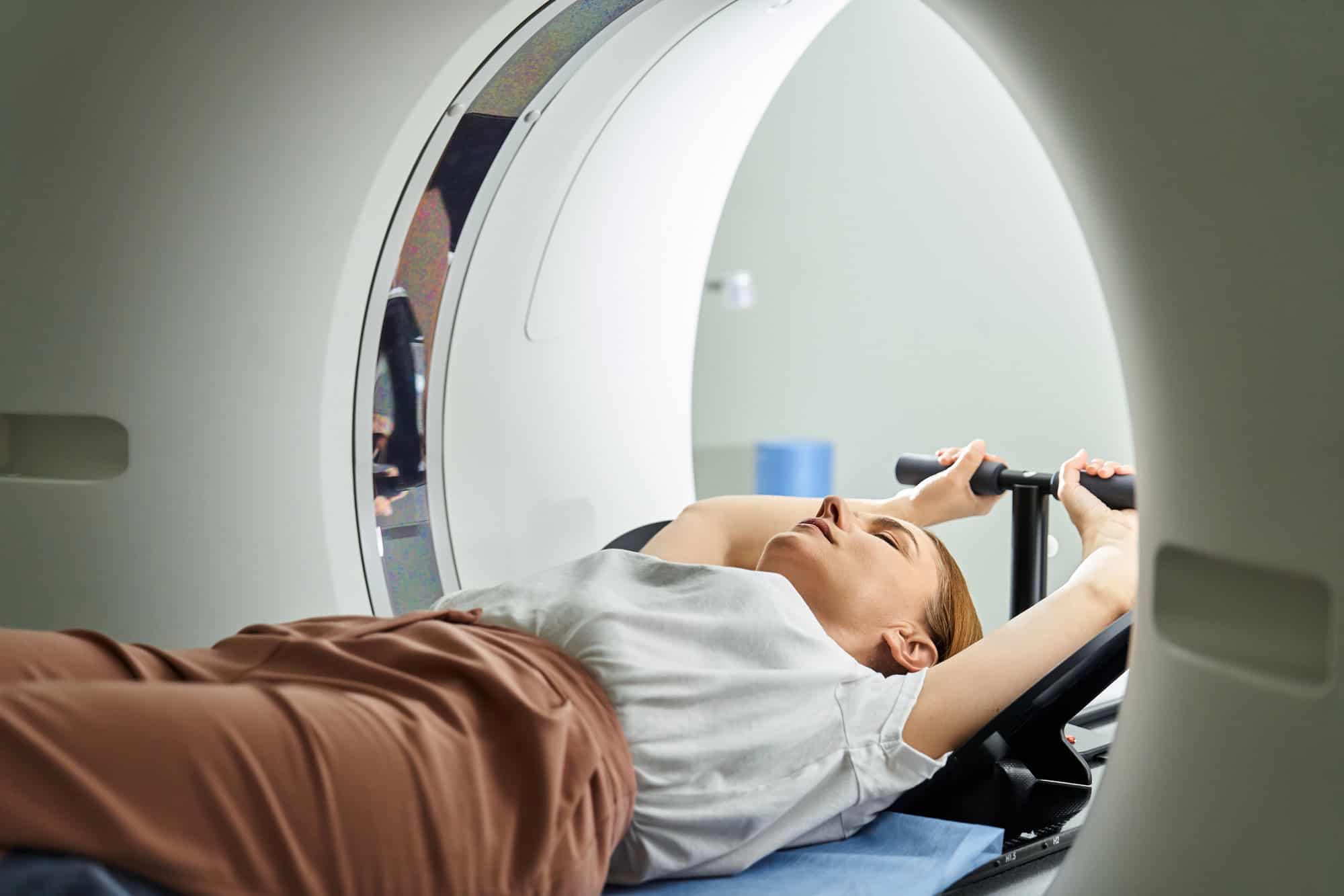 A patient undergoing a magnetic resonance imaging (MRI) scan in a medical facility; following best practices for documenting LTD claims.